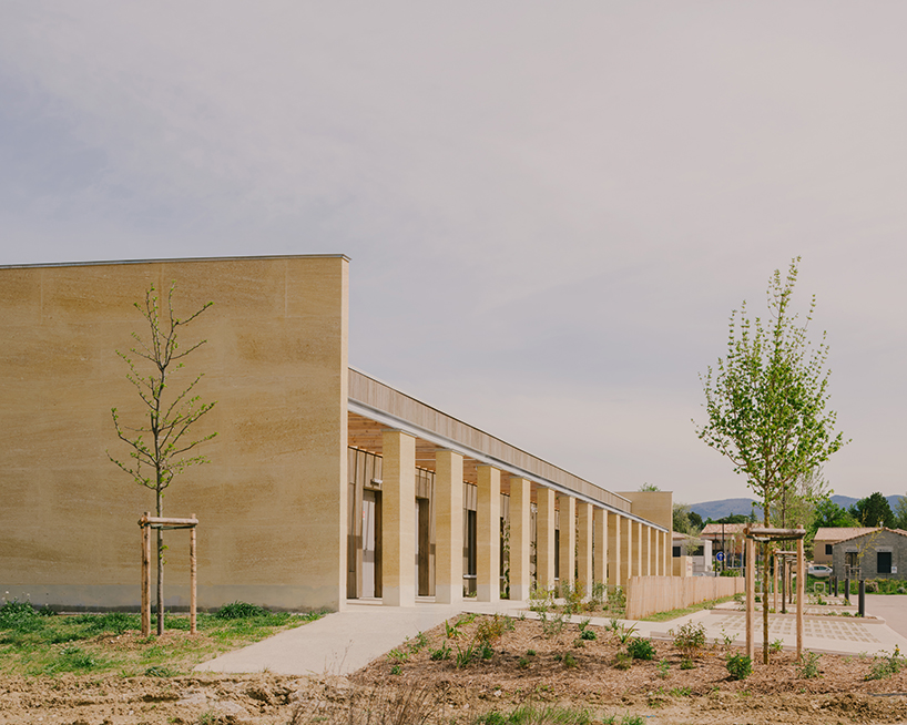 mineral stone wall enclosure frames tectoniques’ cultural center in france - 1