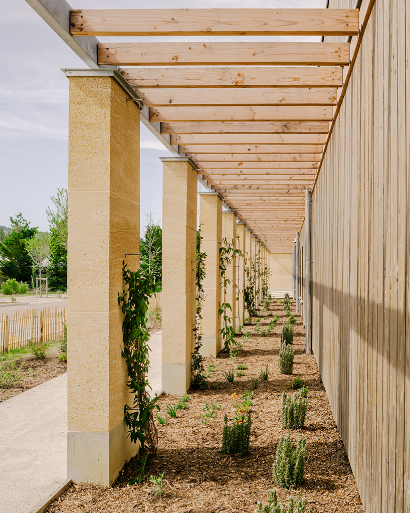 tectoniques designs a cultural center shaped by a mineral stone enclosure 4