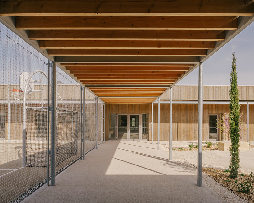 tectoniques designs a cultural center shaped by a mineral stone enclosure 7