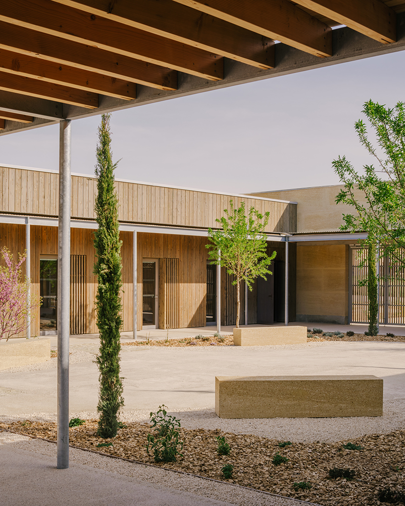 tectoniques designs a cultural center shaped by a mineral stone enclosure 8