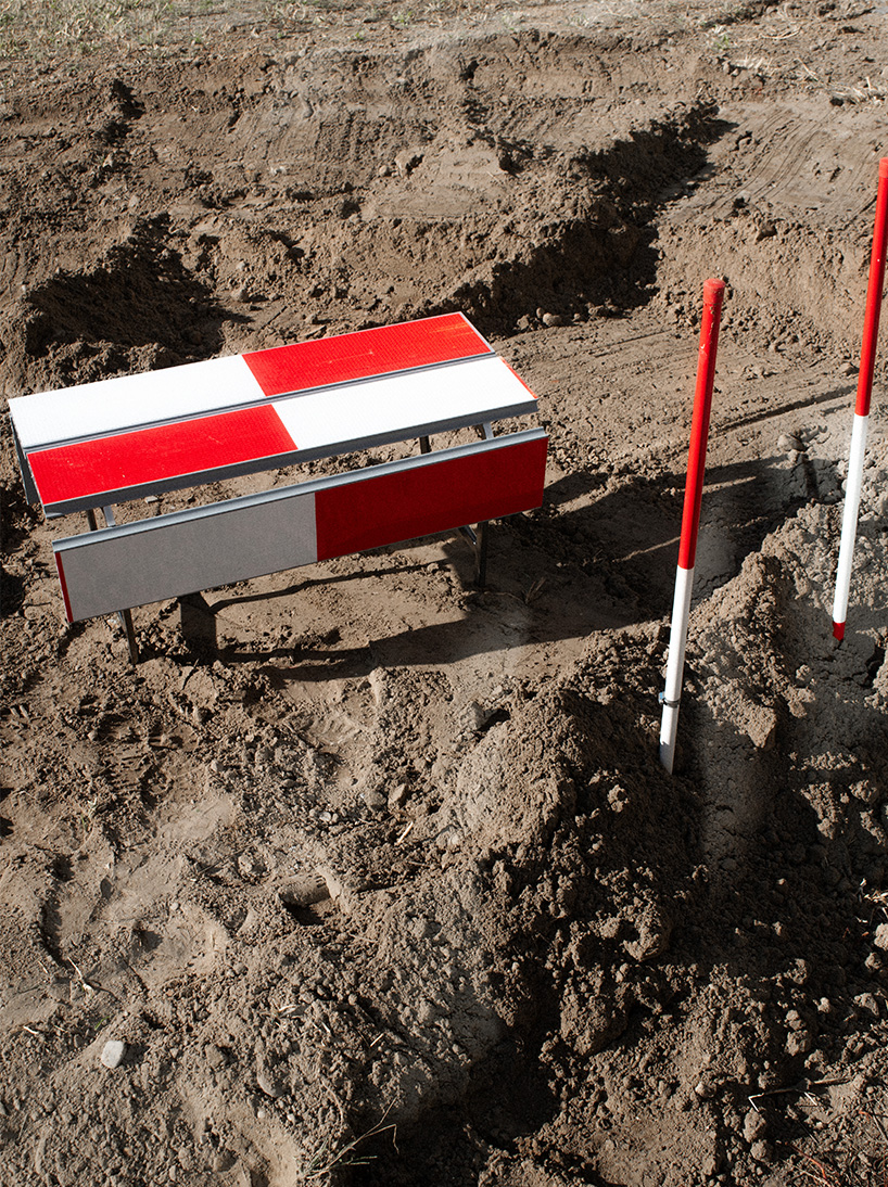 red-and-white aluminum safety barriers convert into public seating at dutch design week - 2