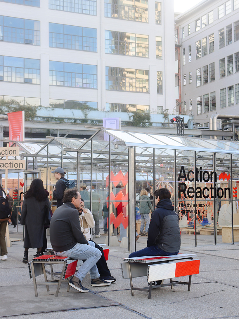 red-and-white aluminum safety barriers convert into public seating at dutch design week - 3