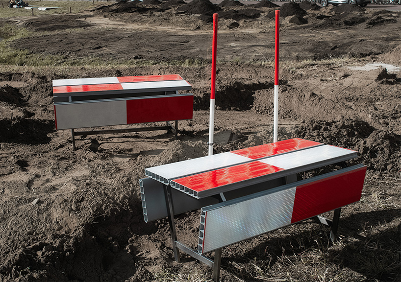 red-and-white aluminum safety barriers convert into public seating at dutch design week - 1