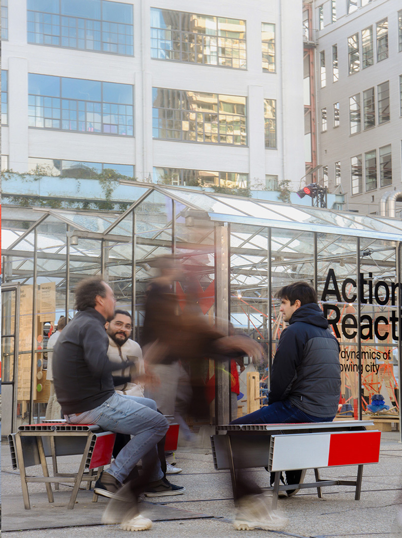 red-and-white aluminum safety barriers convert into public seating at dutch design week - 5