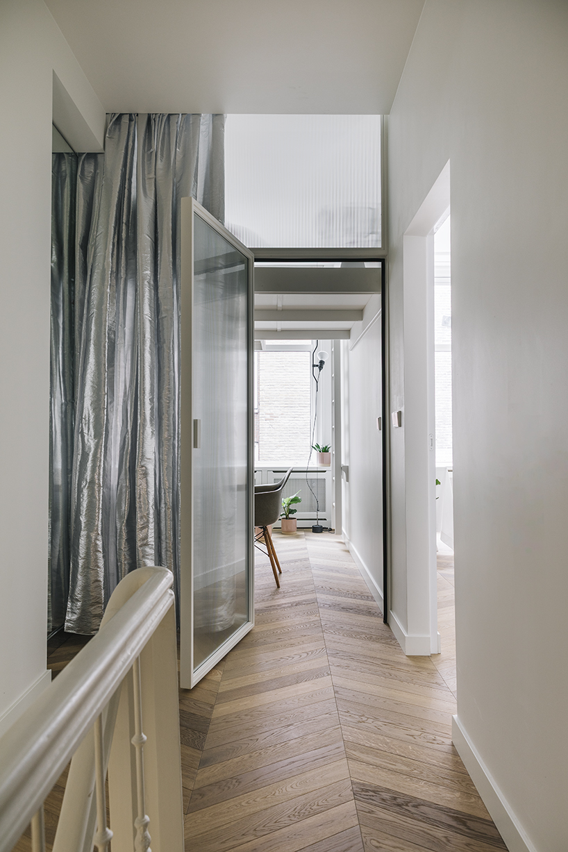 mirrors, ribbed glass, and light boxes open up a narrow amsterdam townhouse - 8