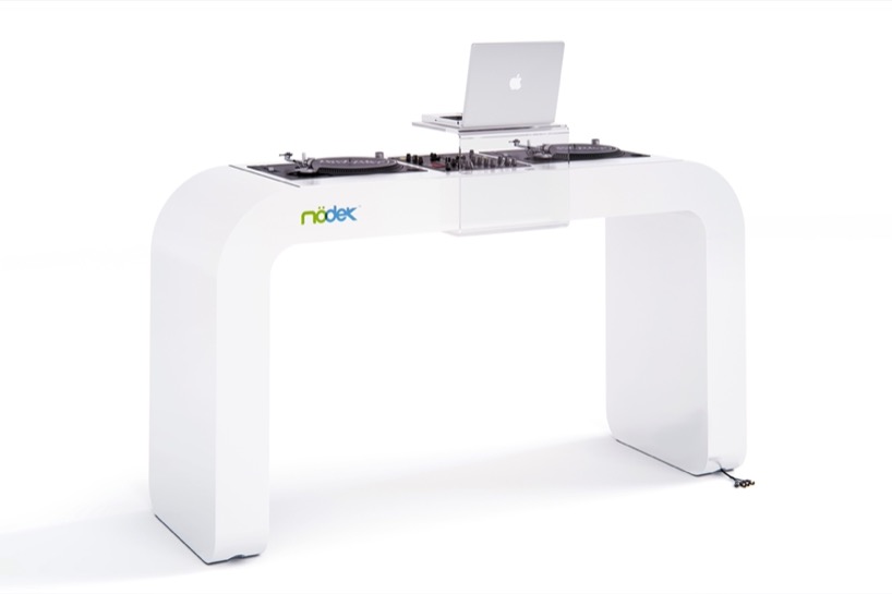 continuous white DJ console integrates turntables, mixers, and hidden cables - 1