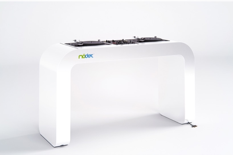 continuous white DJ console integrates turntables, mixers, and hidden cables - 3