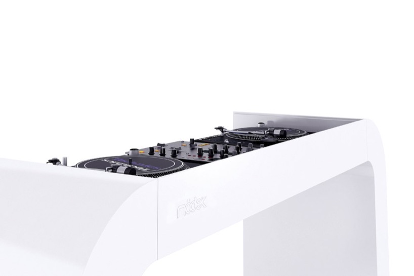 continuous white DJ console integrates turntables, mixers, and hidden cables - 4