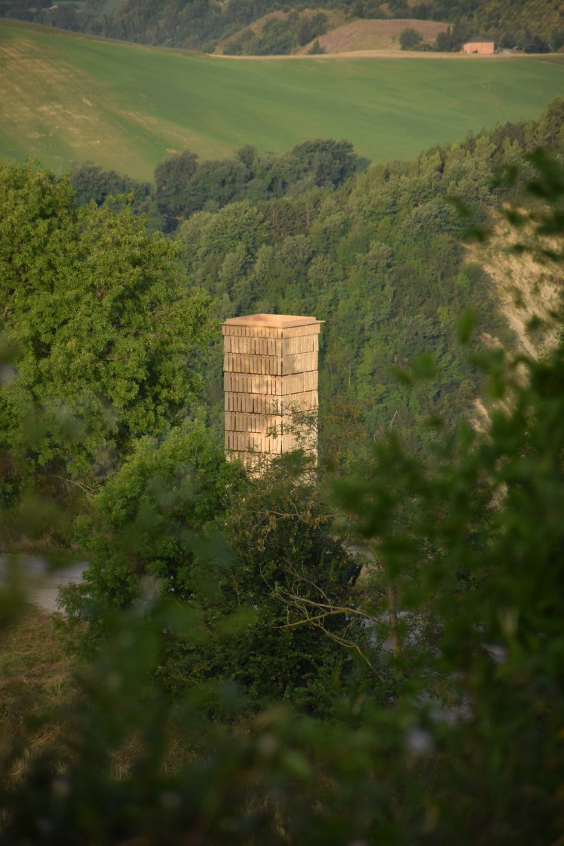 moving shingles envelop timber tower reinterpreting lunano’s stone architecture - 2
