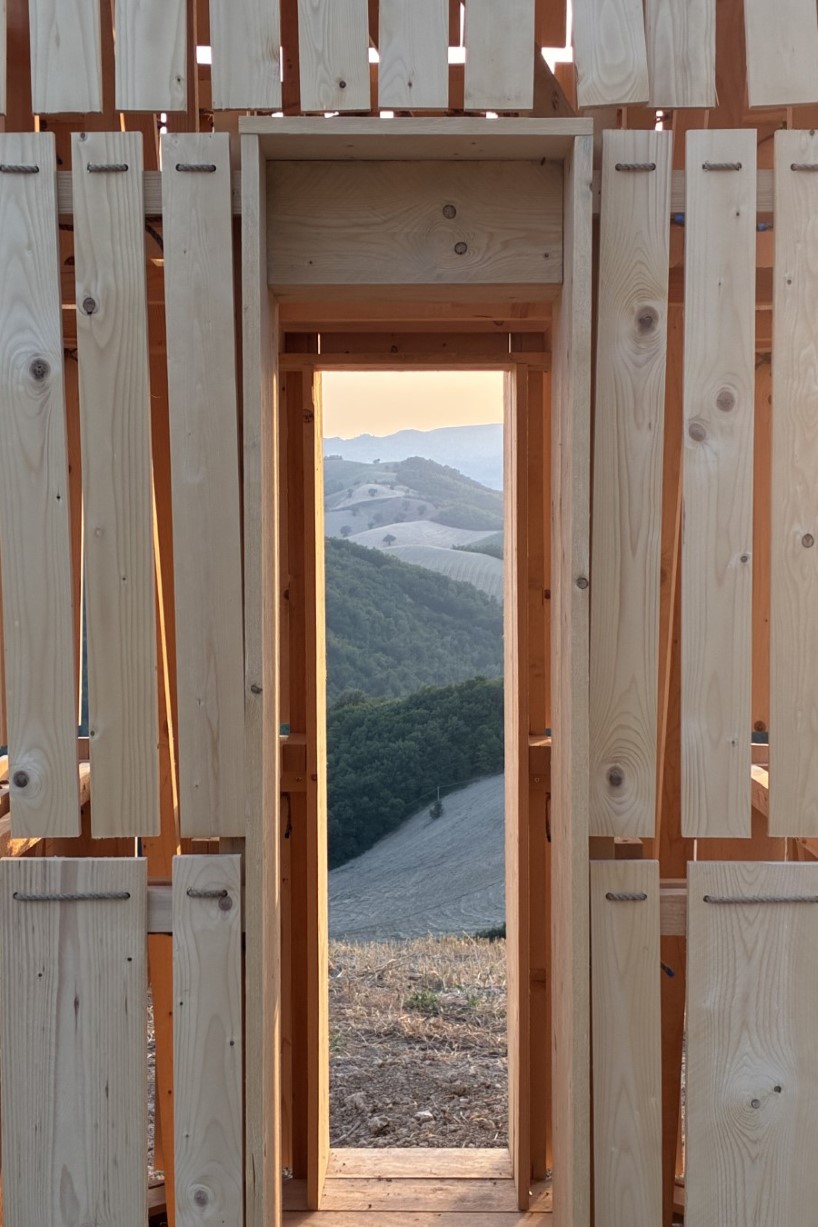 moving shingles envelop timber tower reinterpreting lunano’s stone architecture - 6