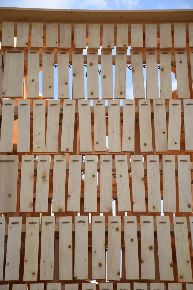moving shingles envelop timber tower reinterpreting lunano’s stone architecture - 7