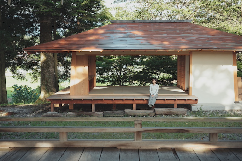 leaning timber frame anchors shrine office in japanese mountain valley - 4