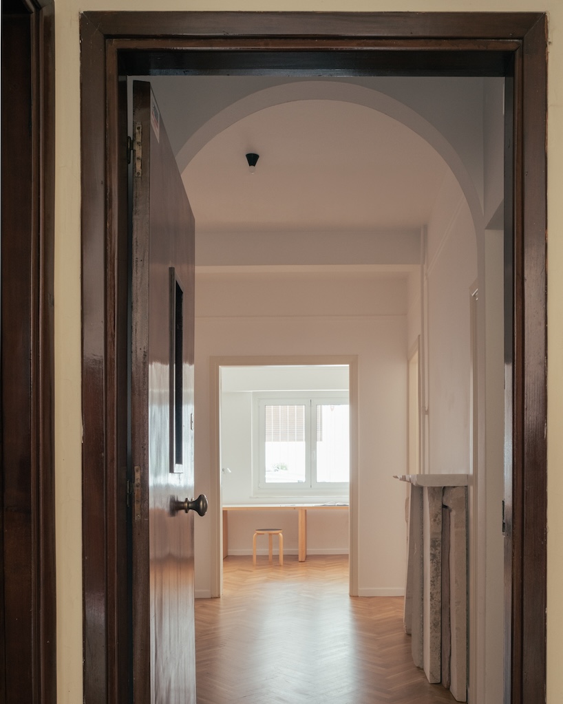 cypress, marble, and rippling glass rework apartment into local local’s athens studio - 2