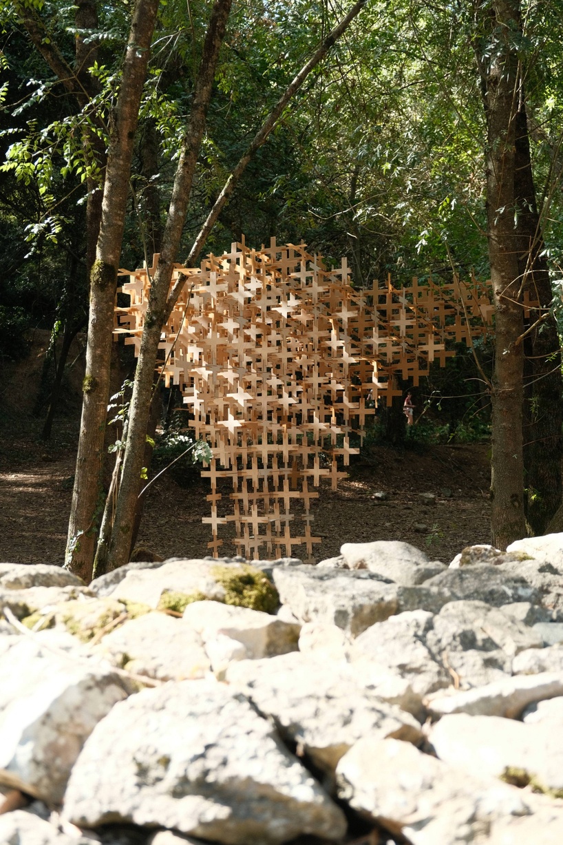 interlocking biodegradable modules weave regenerative pavilion into gavarres landscape - 4