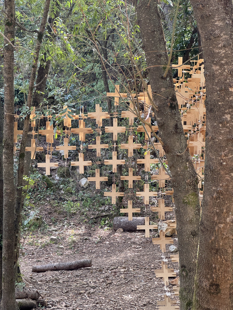 interlocking biodegradable modules weave regenerative pavilion into gavarres landscape - 5