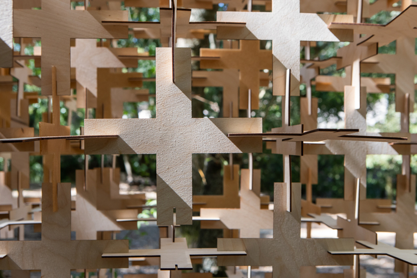 interlocking biodegradable modules weave regenerative pavilion into gavarres landscape - 7