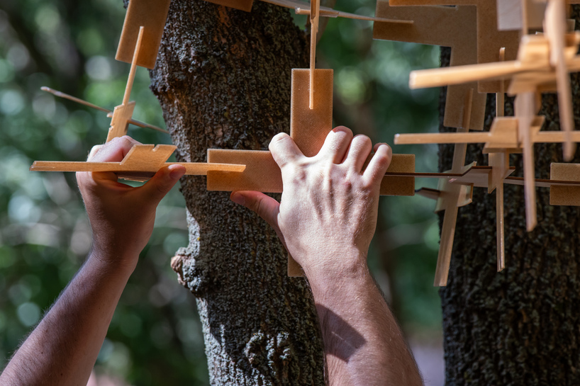 interlocking biodegradable modules weave regenerative pavilion into gavarres landscape - 8