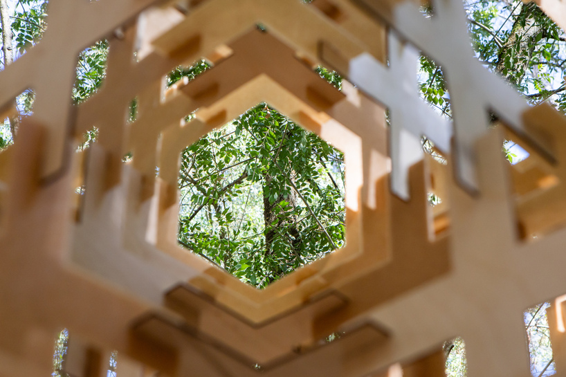 interlocking biodegradable modules weave regenerative pavilion into gavarres landscape - 10
