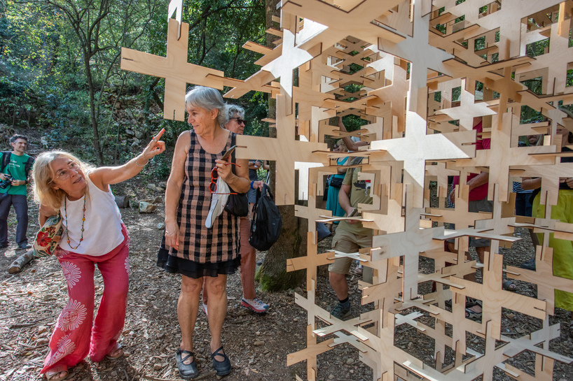 interlocking biodegradable modules weave regenerative pavilion into gavarres landscape - 12