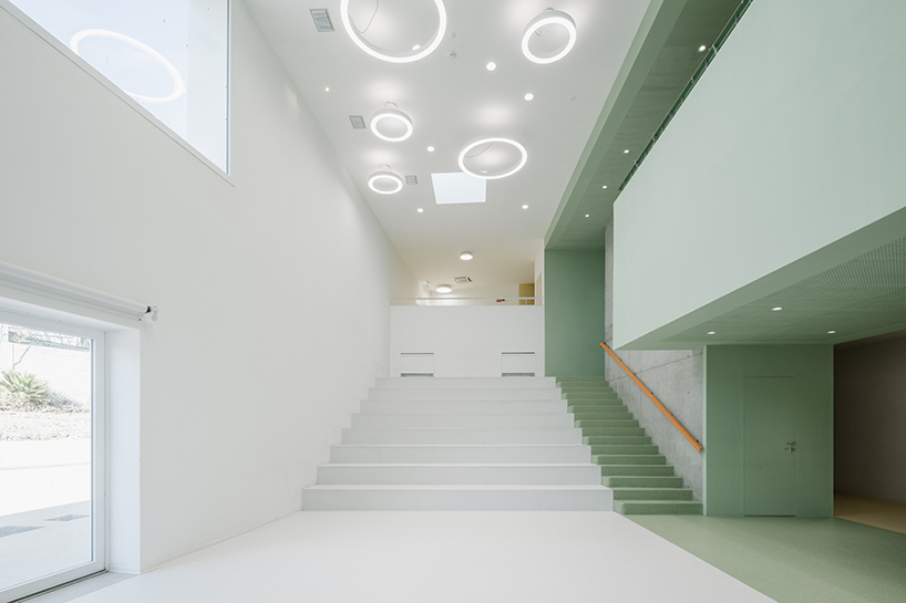 sardinian school wraps in perforated aluminum facade to enclose flexible agorà - 5