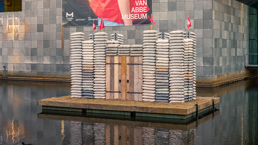 sandbag castle casts sustainable concrete alternatives into floating installation in eindhoven - 3