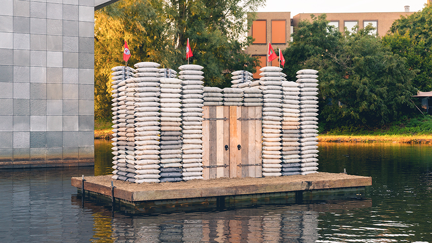 sandbag castle casts sustainable concrete alternatives into floating installation in eindhoven - 4