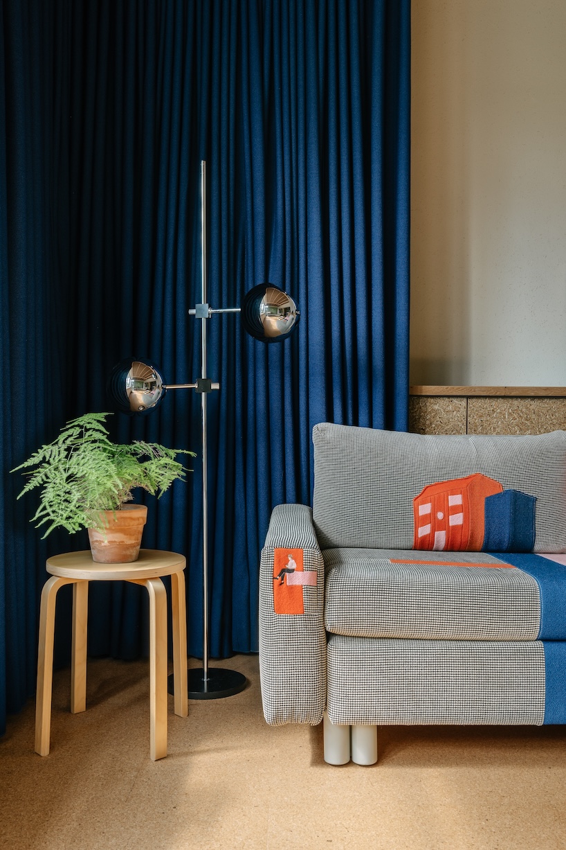 stepped timber platforms and operable textiles shape circular düsseldorf home by urselmann interior - 3