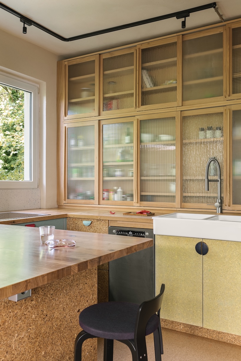 stepped timber platforms and operable textiles shape circular düsseldorf home by urselmann interior - 4