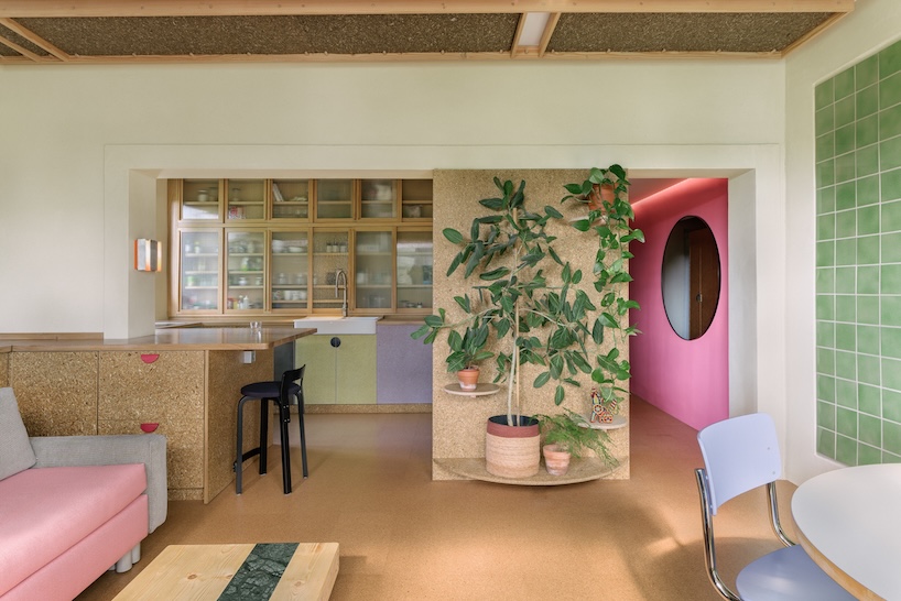 stepped timber platforms and operable textiles shape circular düsseldorf home by urselmann interior - 1