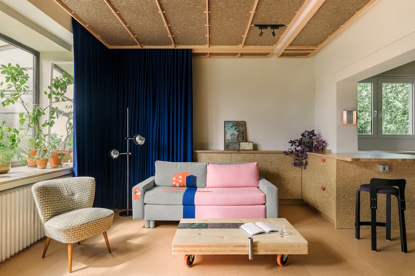 stepped timber platforms and operable textiles shape circular düsseldorf home by urselmann interior - 2