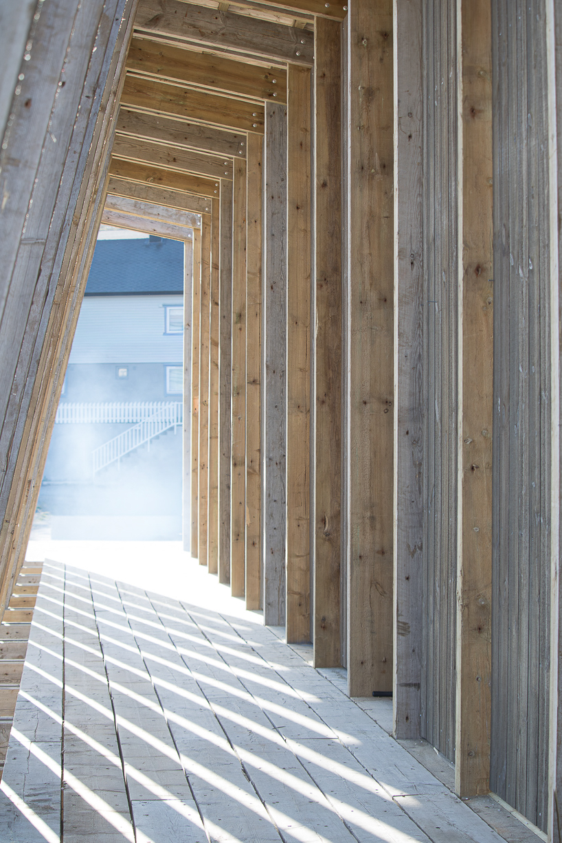 reclaimed timber frames shape skroget coastal sauna and community hub in norway - 6