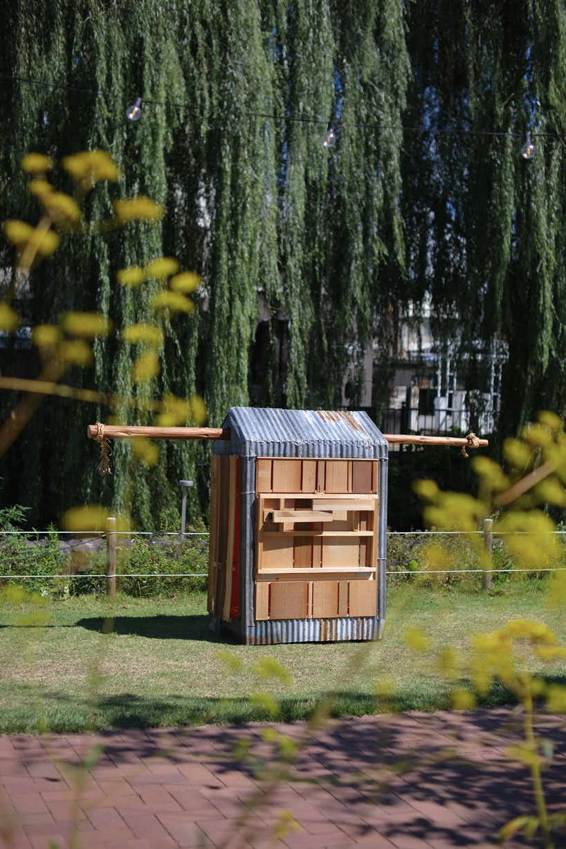 portable barn reinterprets hand-carried palanquin