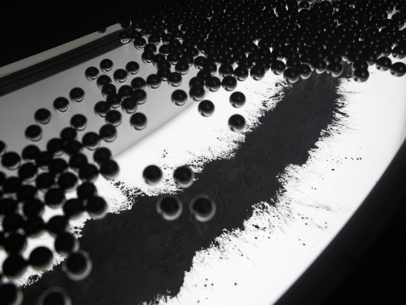 steel spheres moving across curved glass frame leonardo garza’s sensory installation for BYREDO - 9