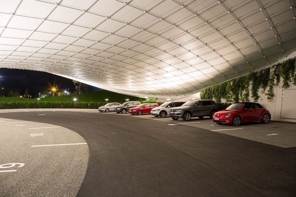 organically shaped autostadt roof and service pavilion by graft