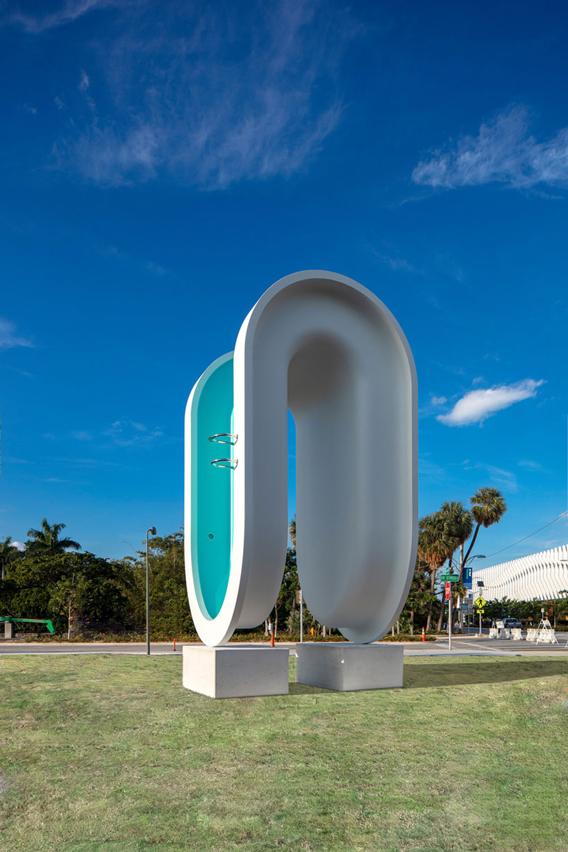 elmgreen & dragset's bent pool sculpture serves as landmark for miami beach designboom
