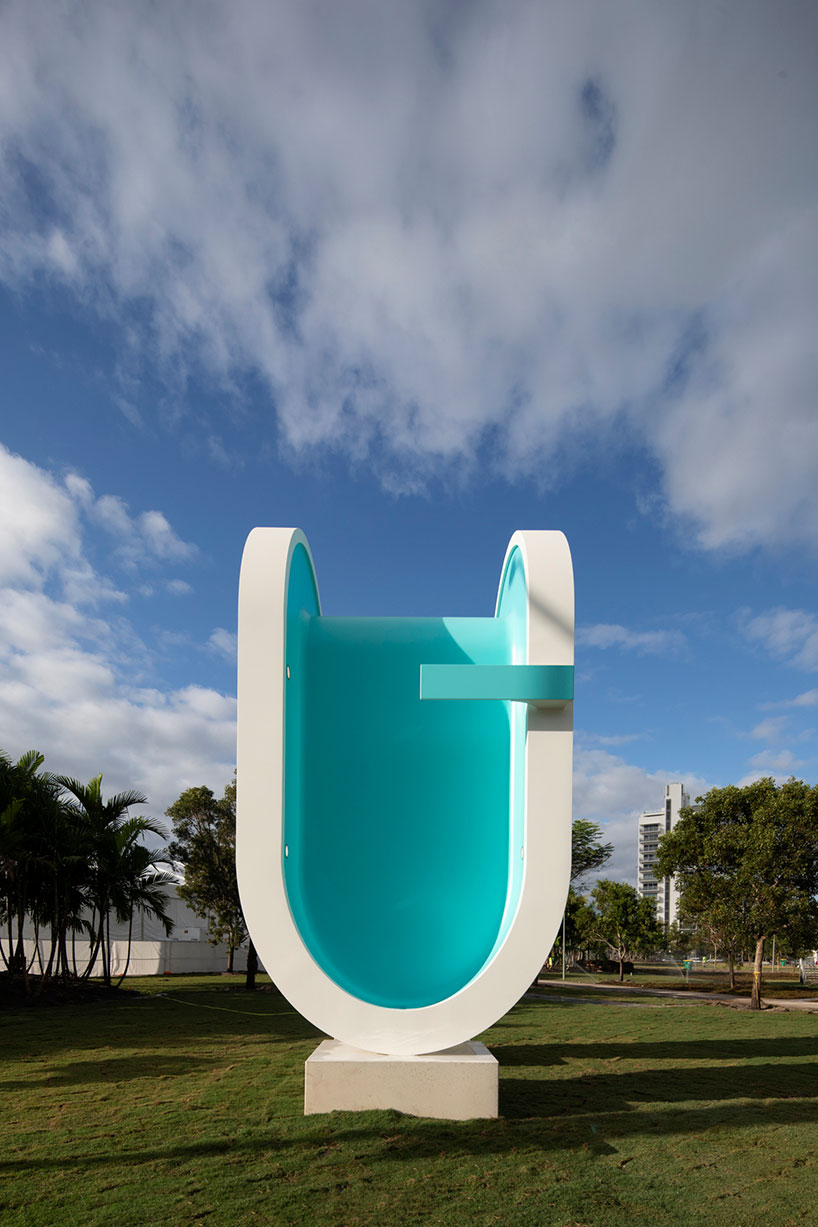 elmgreen & dragset's bent pool sculpture serves as landmark for miami beach designboom