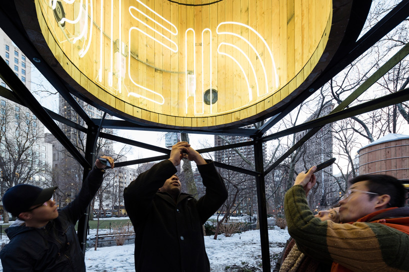 ivan navarro places infinite neons within water tower sculptures