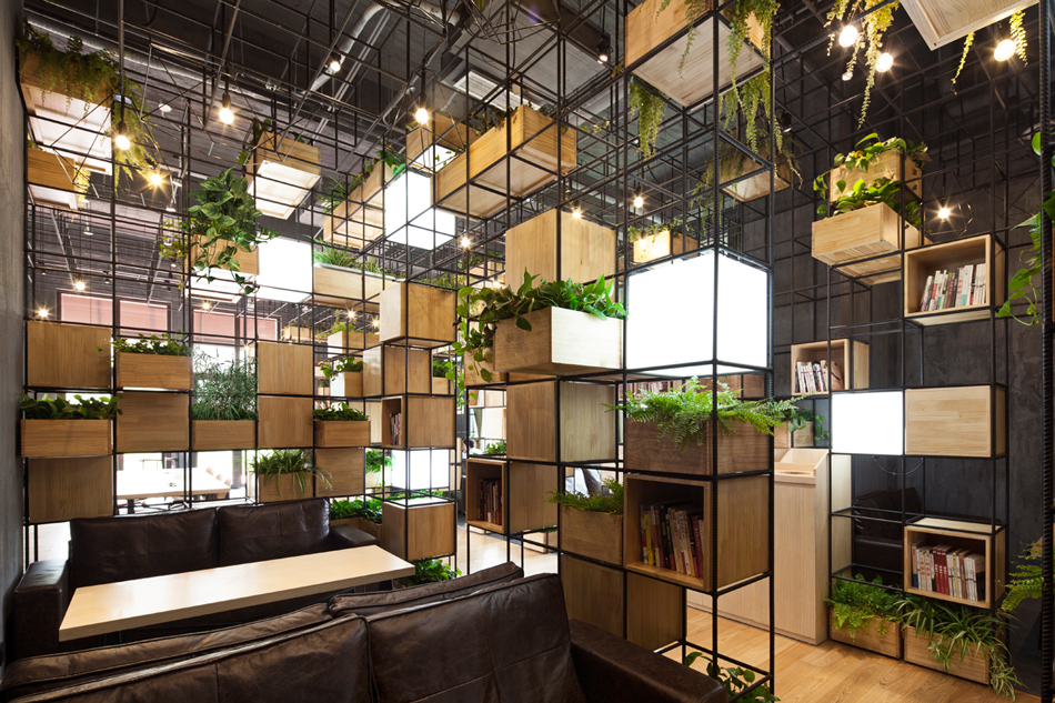 recycled steel bars form modular café interior by penda