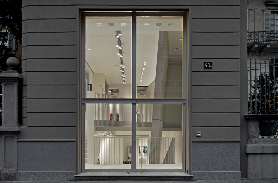 tadao ando defines duvetica showroom in milan with inclined cement wall