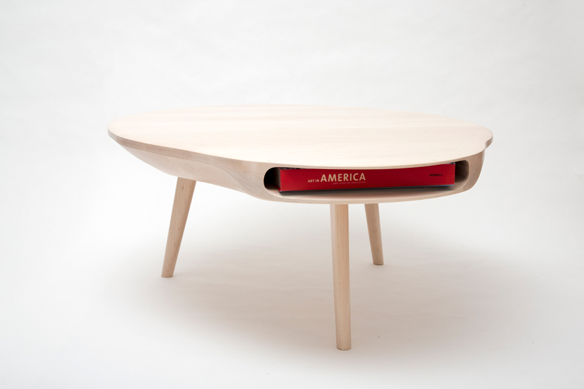 tokyo table by loic bard features discreet storage compartment