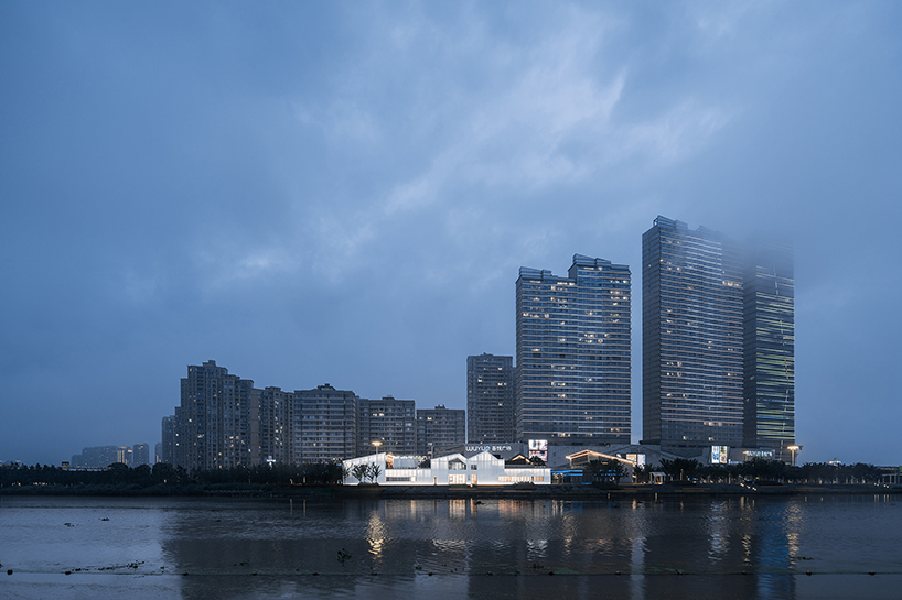 wutopia lab wraps bookstore in china in white perforated panel wall