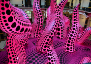 yayoi kusama's retrospective spreads polka dots at gropius bau in berlin