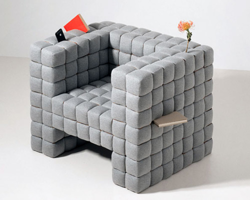 daisuke motogi make the cracks between seat cushions purposeful with 'lost in sofa'