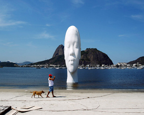 sculpture by jaume plensa emerges from guanabara bay in rio de janeiro
