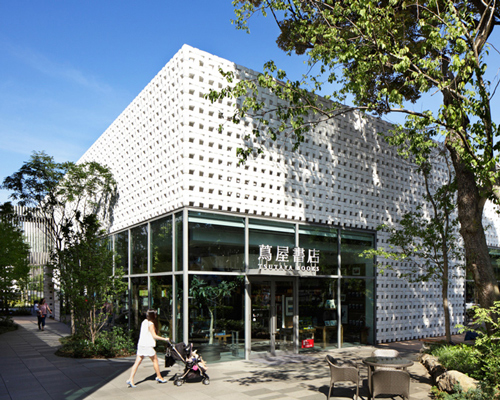 klein dytham architecture clads cartier store façade in geometric