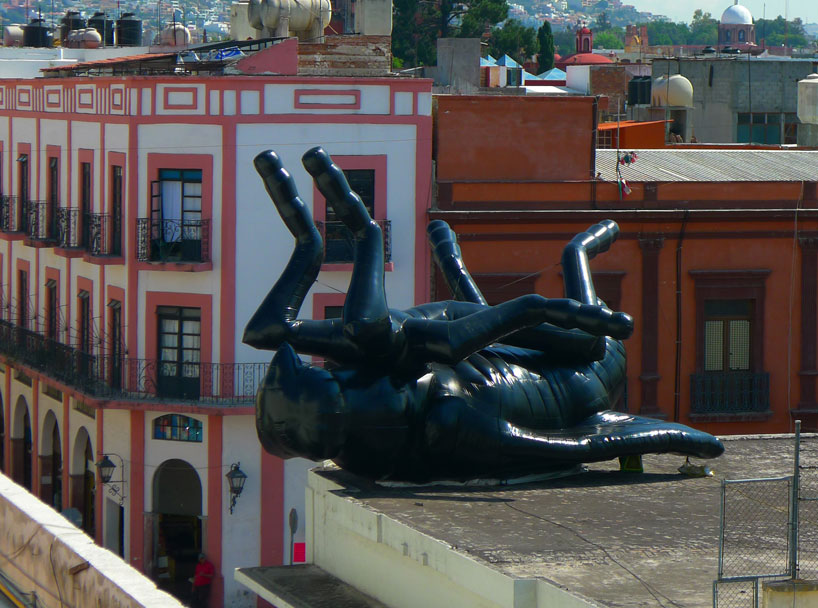 'the dead fly' by florentijn hofman looks over the city of queretaro, mexico