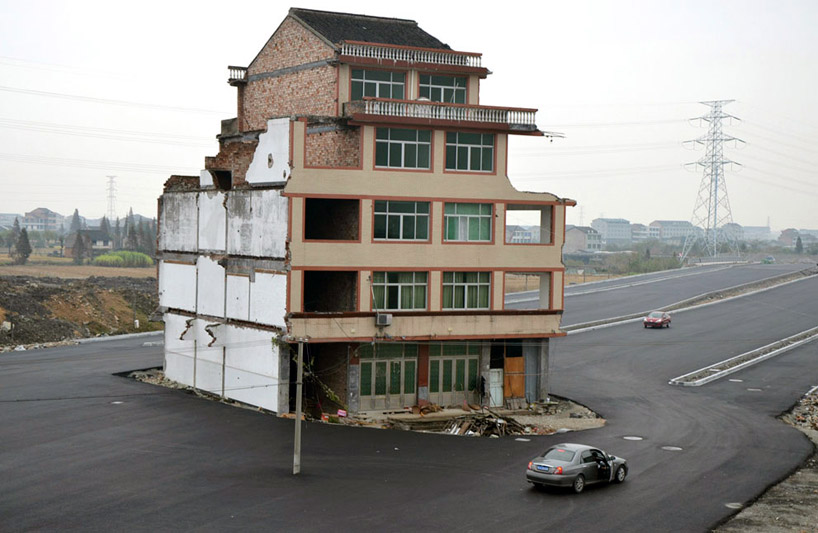 stranded house in the middle of a newly built road in china