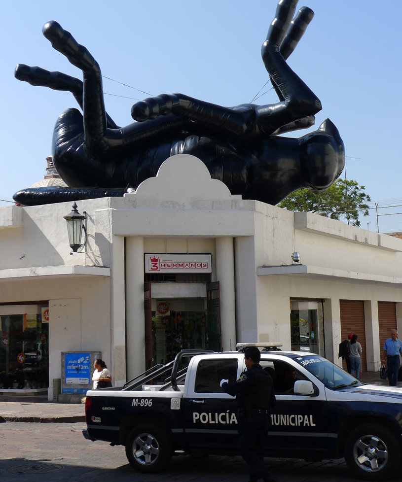 'the dead fly' by florentijn hofman looks over the city of queretaro, mexico