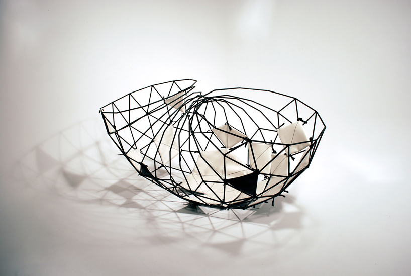 vertice   a cradle like steel cage chaise longue