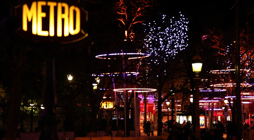 tree rings by ACT lighting design illuminate the champs elysée in paris